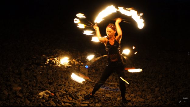 Fire dancing girl on a Canary Island beach